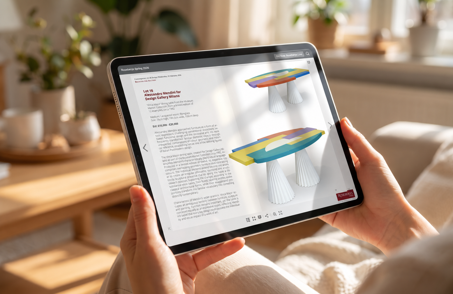 Interactive AfterIssue auction catalogue displayed on an iPad